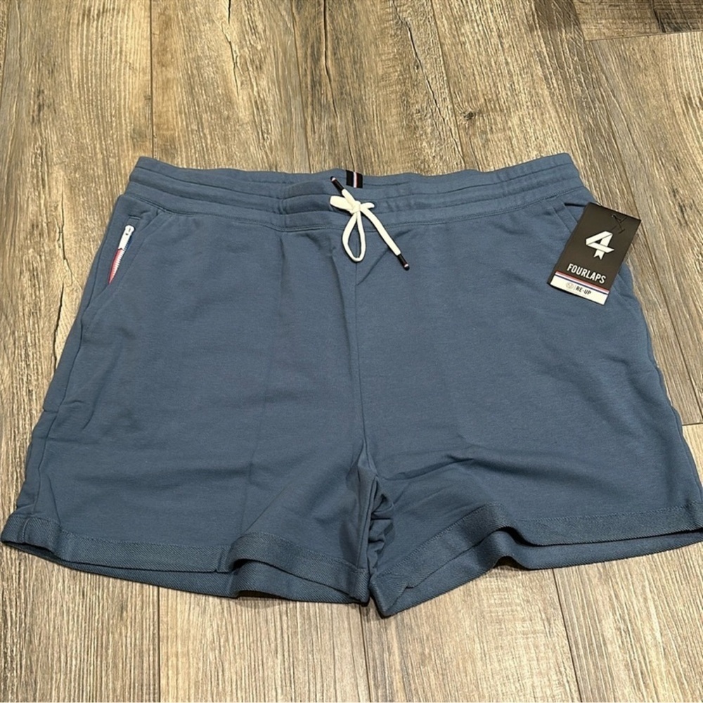 Nwt Fourlaps shorts. High end. Color is steel blue. Size small.